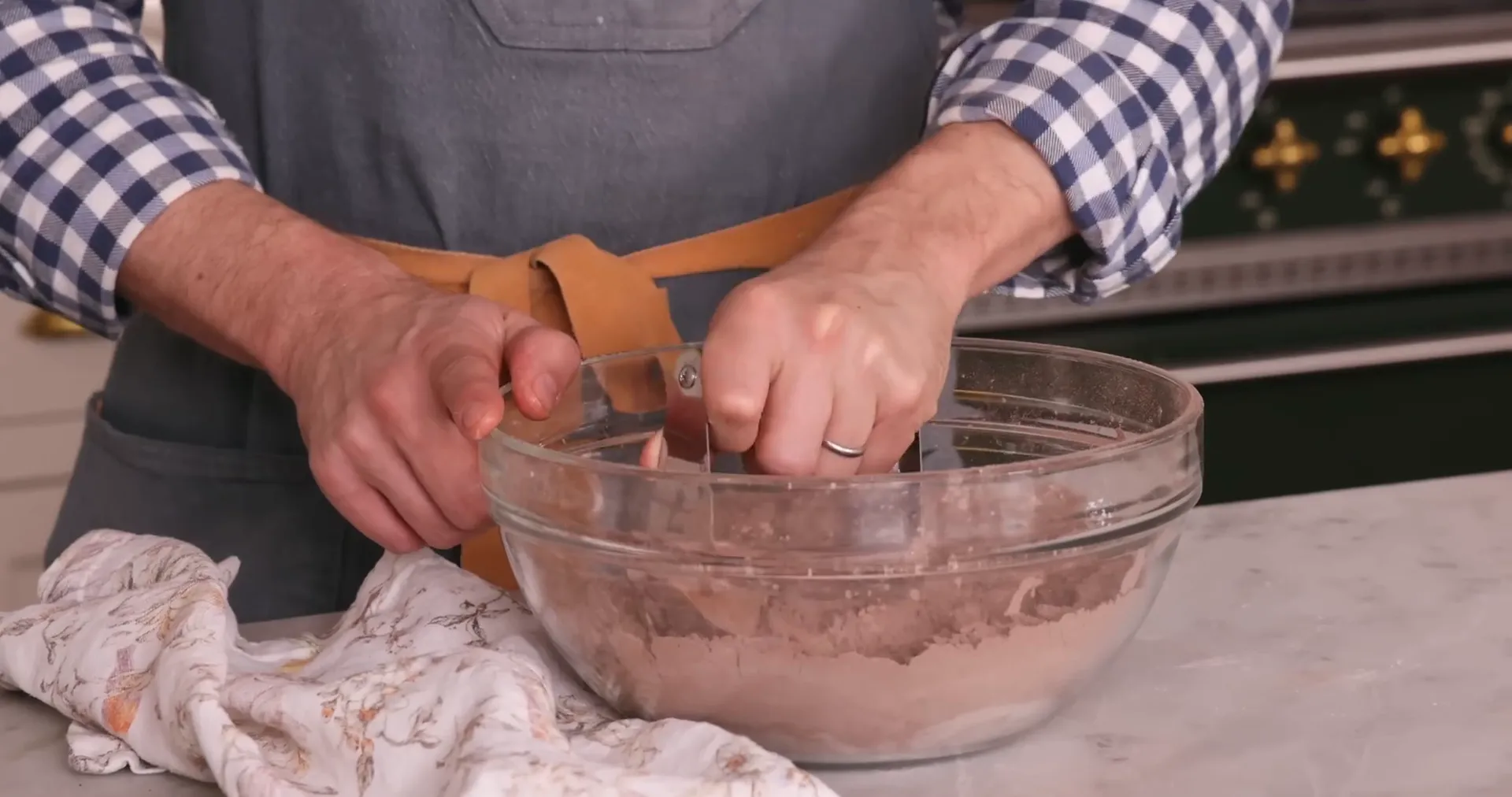 Using a pastry blender to cut cold butter into flour mixture