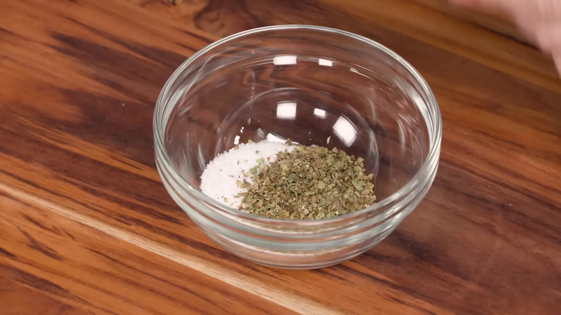 Mixing the salt and herb rub in a small bowl
