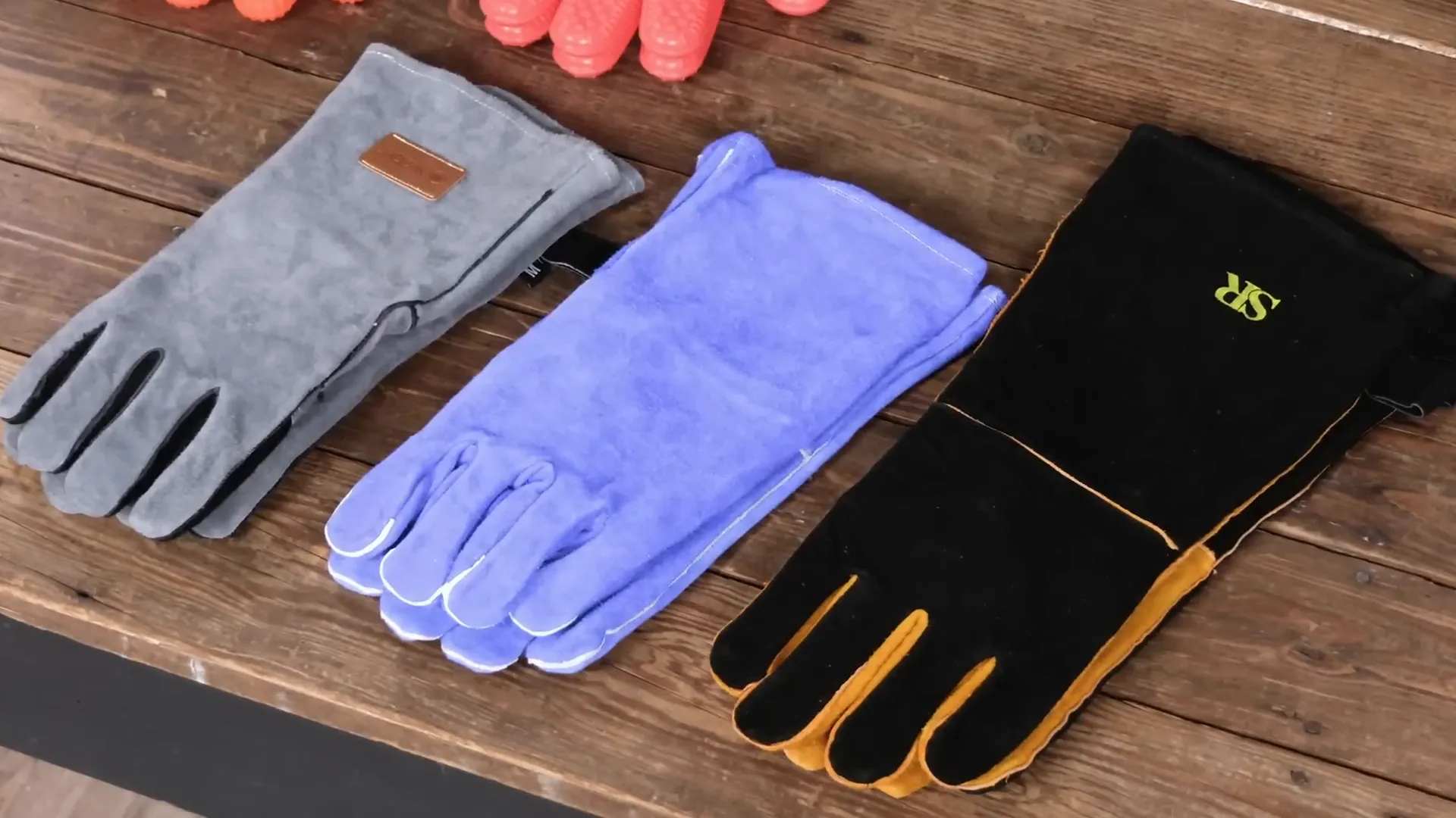 Close-up of suede and silicone grill gloves