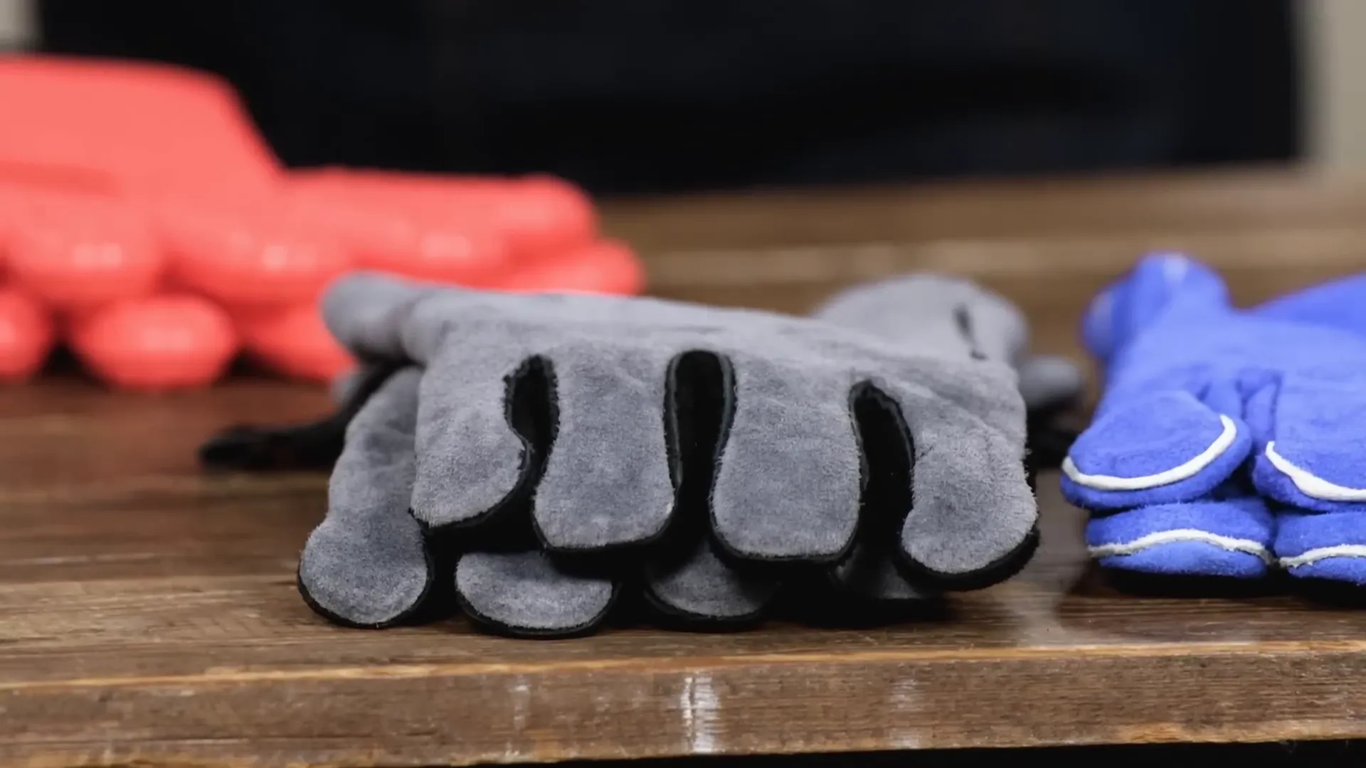 WZQH leather forged welding gloves in use on a grill