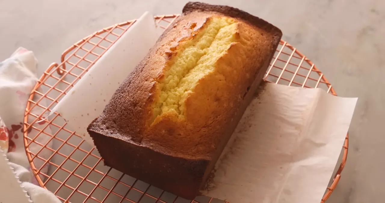 Freshly baked pound cake cooling on rack