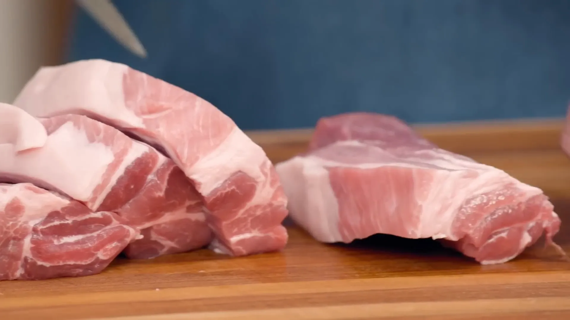 Chunks of pork butt ready for cooking