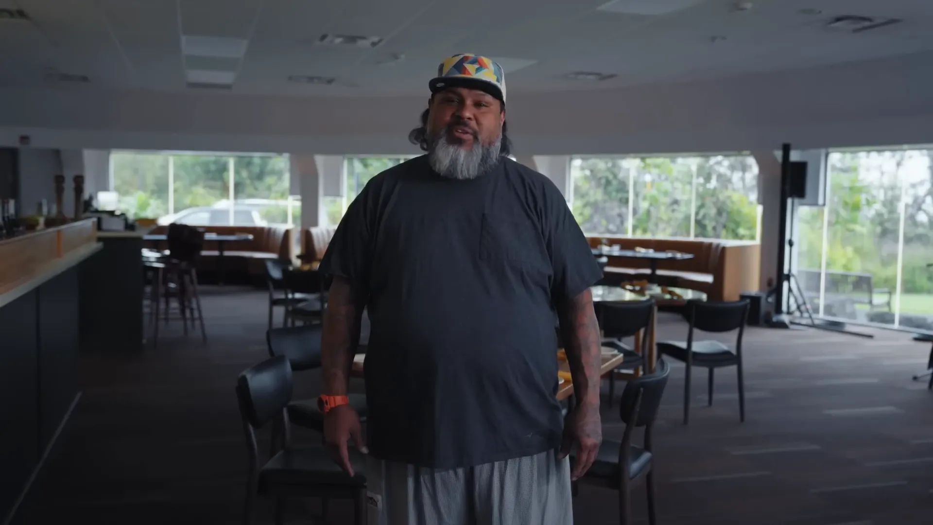 Chef Keanu Reggador welcoming guests inside Lehua restaurant in Hilo
