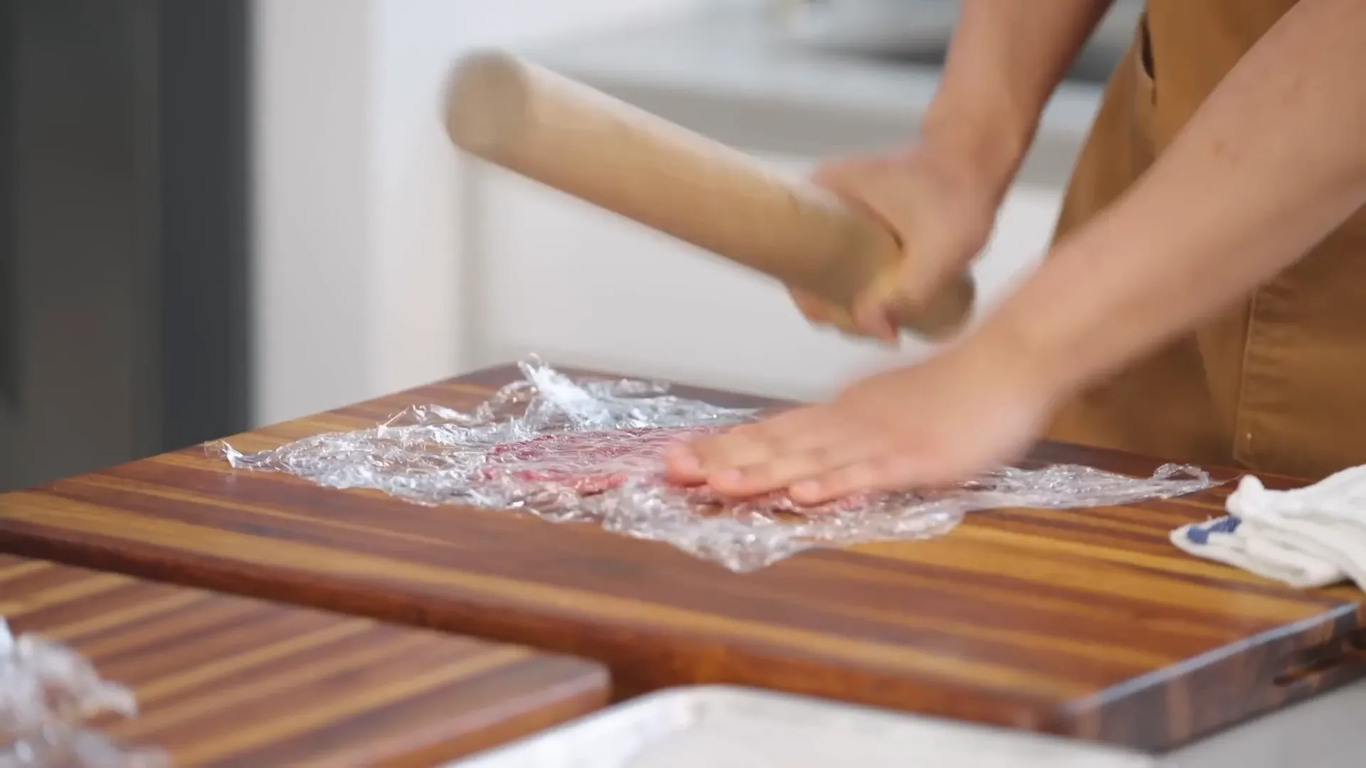 Pounding the top round steaks thin for quick cooking