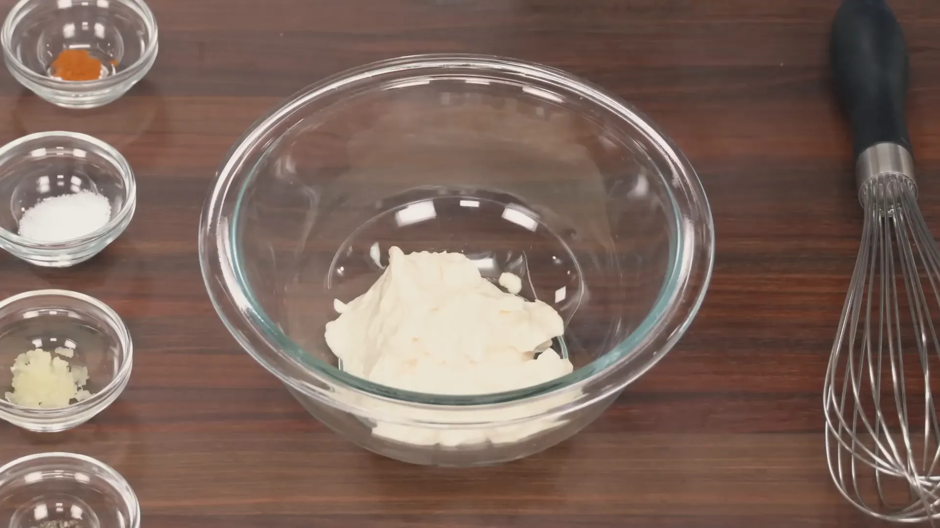 Horseradish sauce being whisked in a bowl