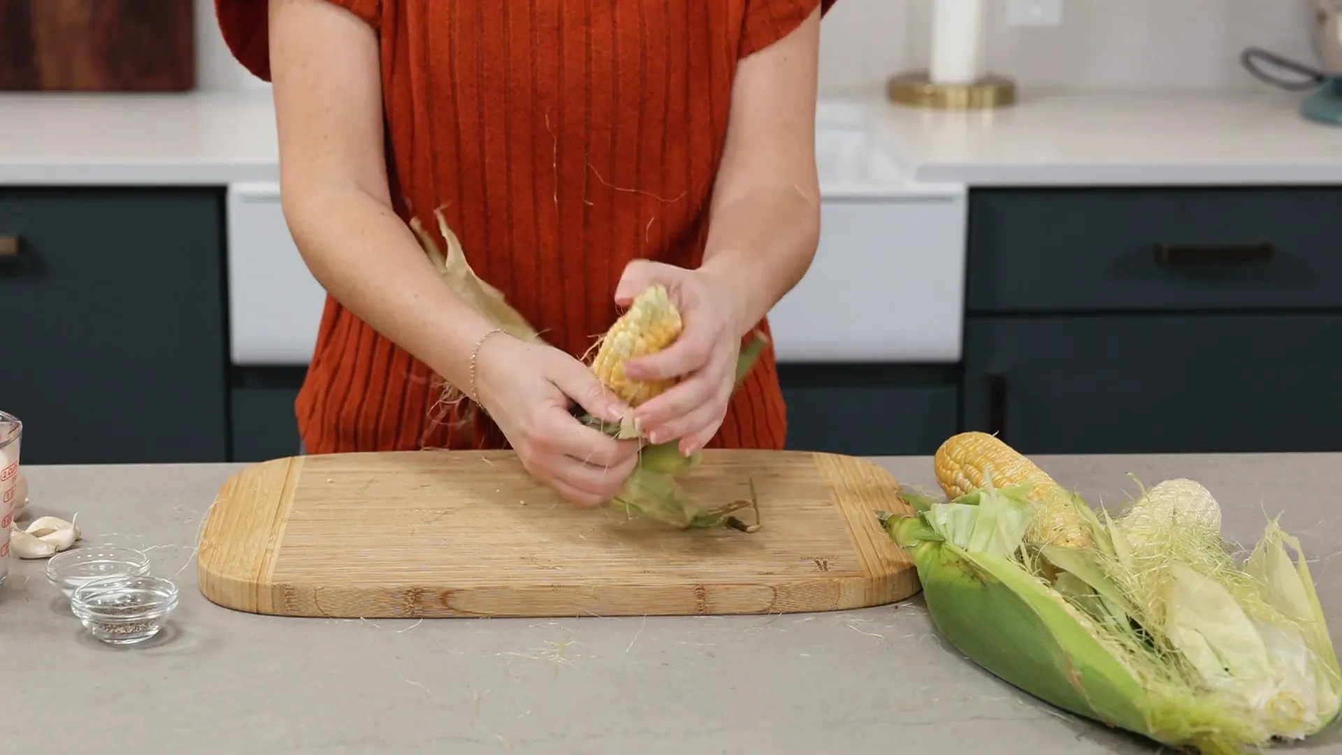 Fresh ears of corn being prepared