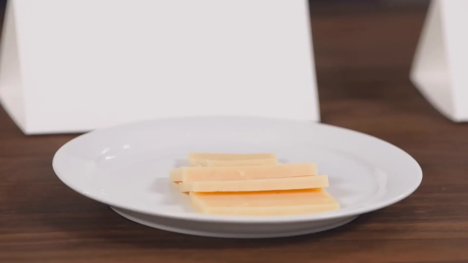 Close-up of buttery, silky cheddar cheese texture