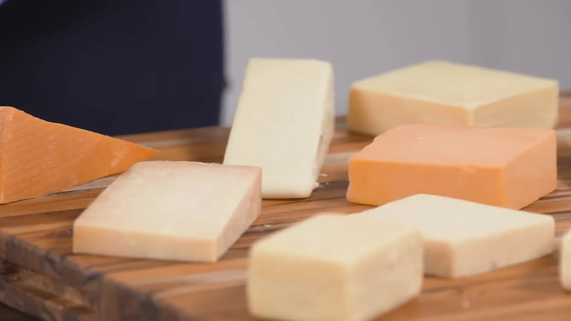 Artisanal American cheddar cheeses on a tasting board