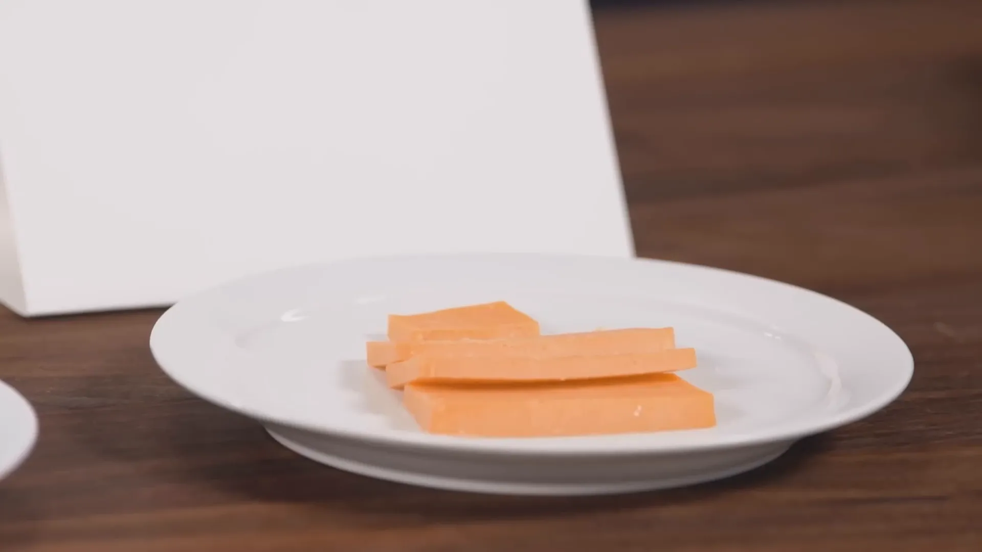 Orange cheddar cheese with distinctive color from annatto oil