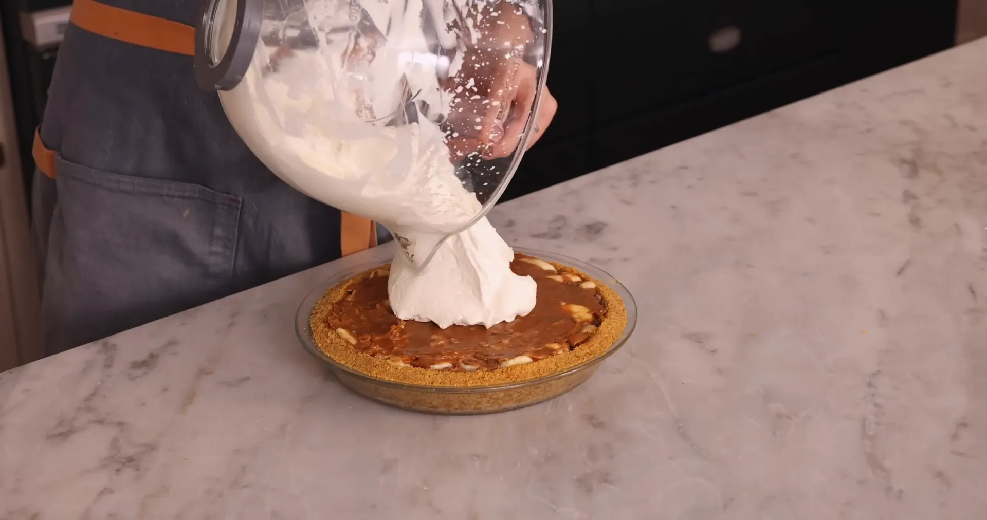 A mountain of whipped cream topping the pie