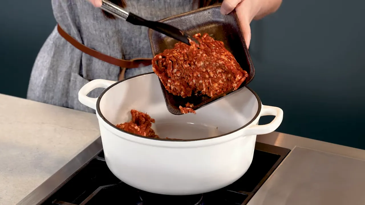 Browning Italian sausage in a large pot