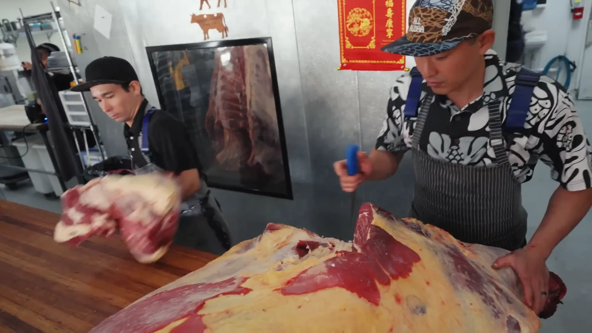 Breaking down beef quarter to fill the display case