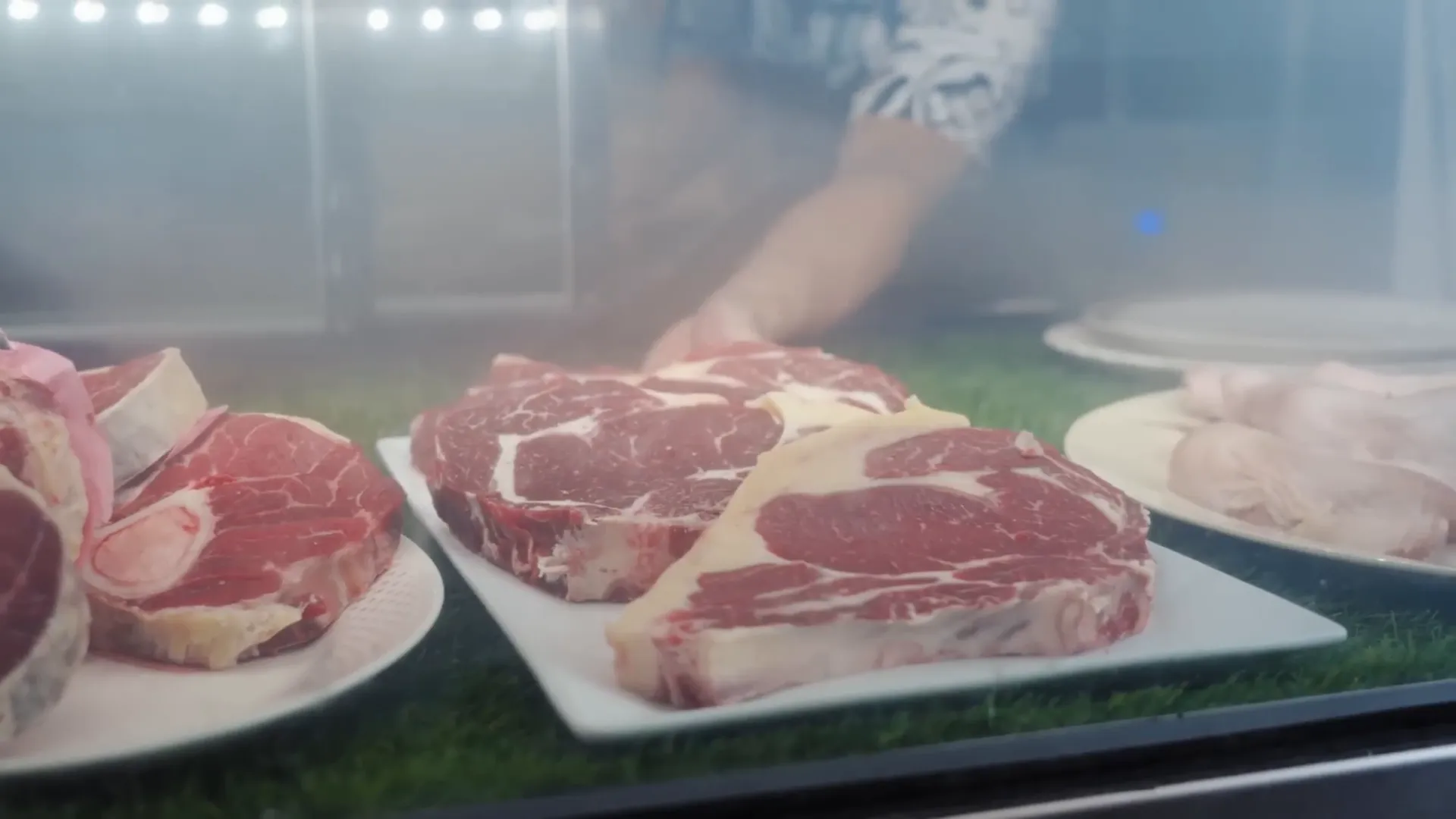 Display case filled with local meats and deli products