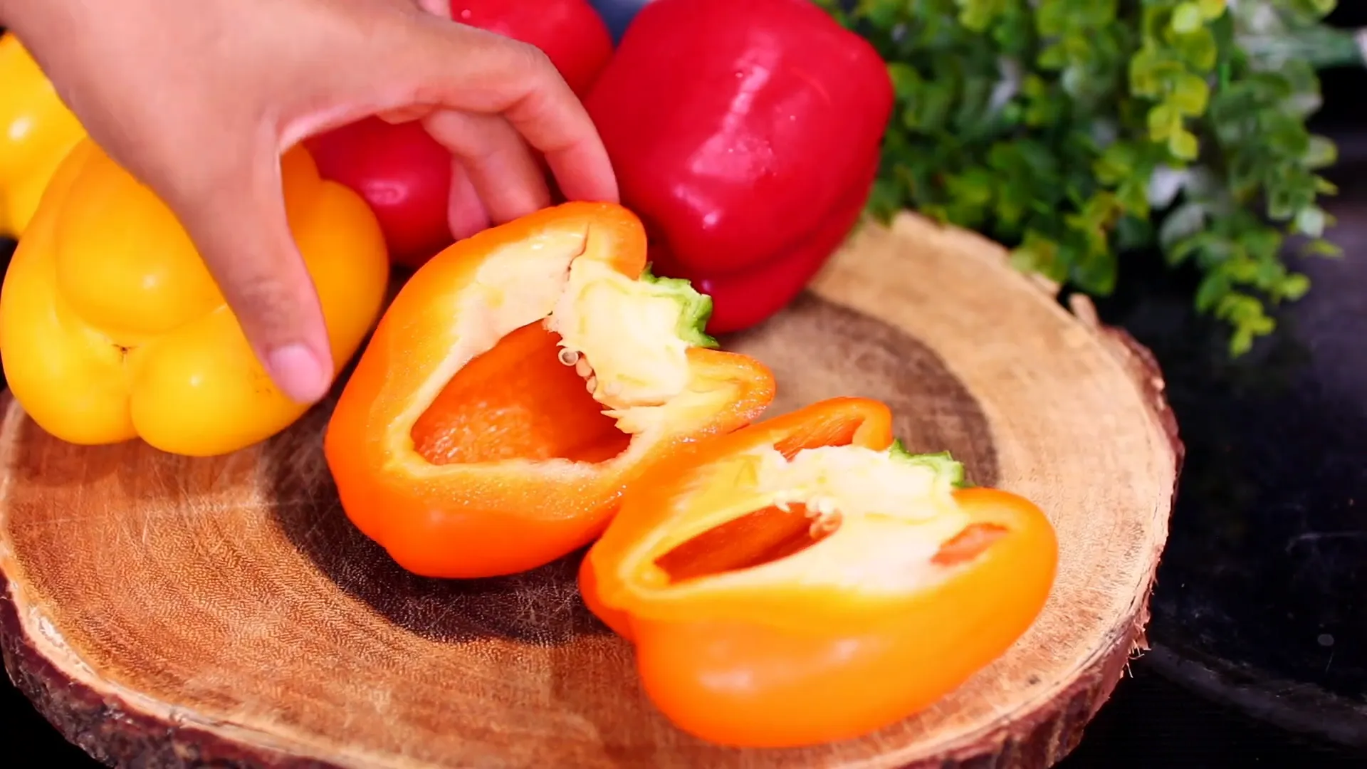 Cutting bell peppers lengthwise and removing seeds.