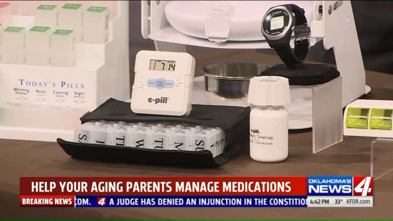 tabletop display with pill organizer devices, digital timer, watch, pill bottle, and reminder products