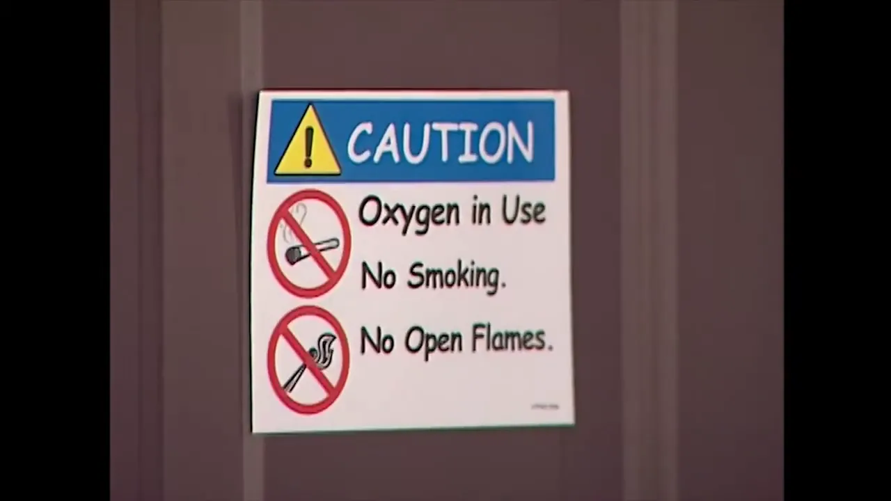 caution sign on a door reading oxygen in use no smoking no open flames