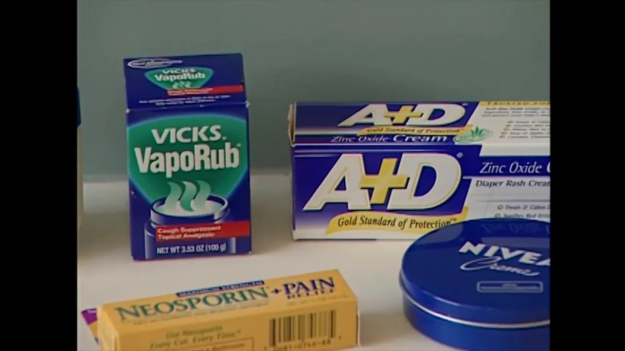 tabletop with Vaseline Vicks VapoRub A plus D ointment and other skin care products
