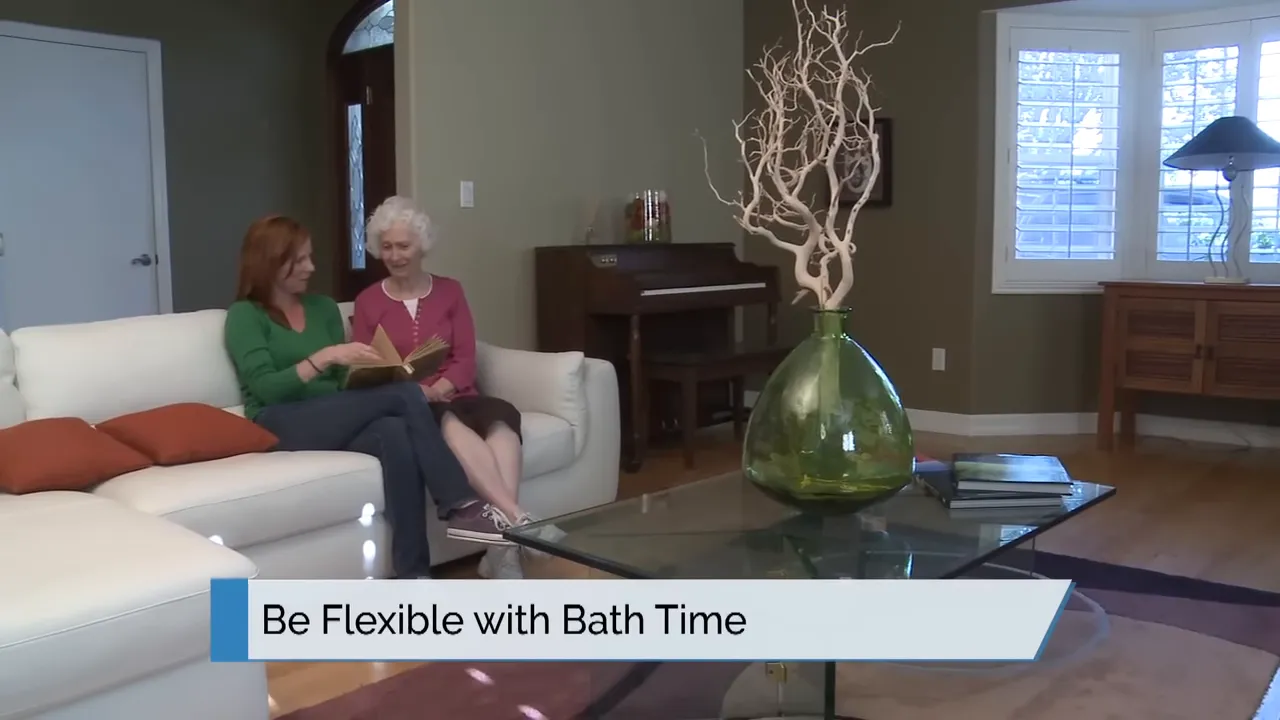 two women sitting on a couch with on screen text be flexible with bath time