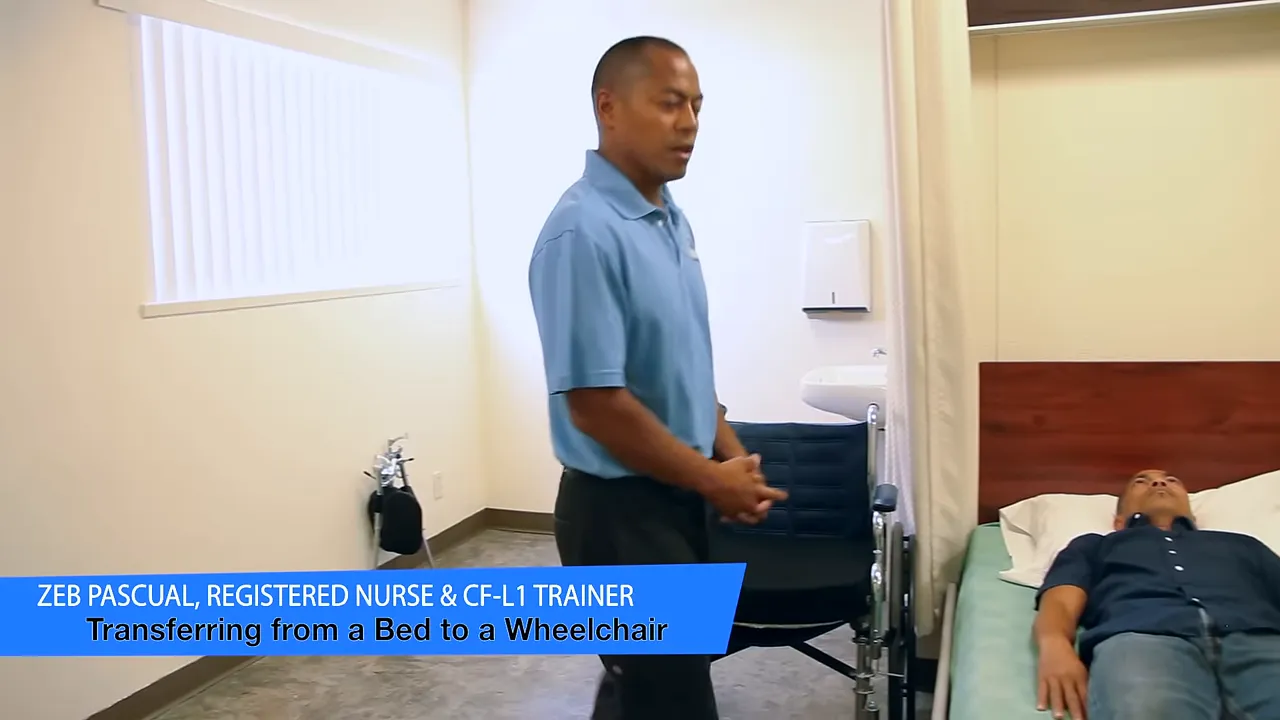 Caregiver standing beside a bed with a wheelchair positioned next to it