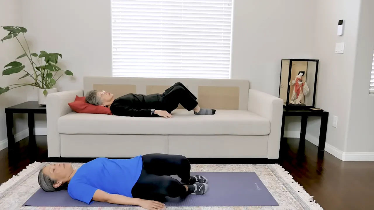 Two exercisers lying on their backs with bent knees moving both legs side to side