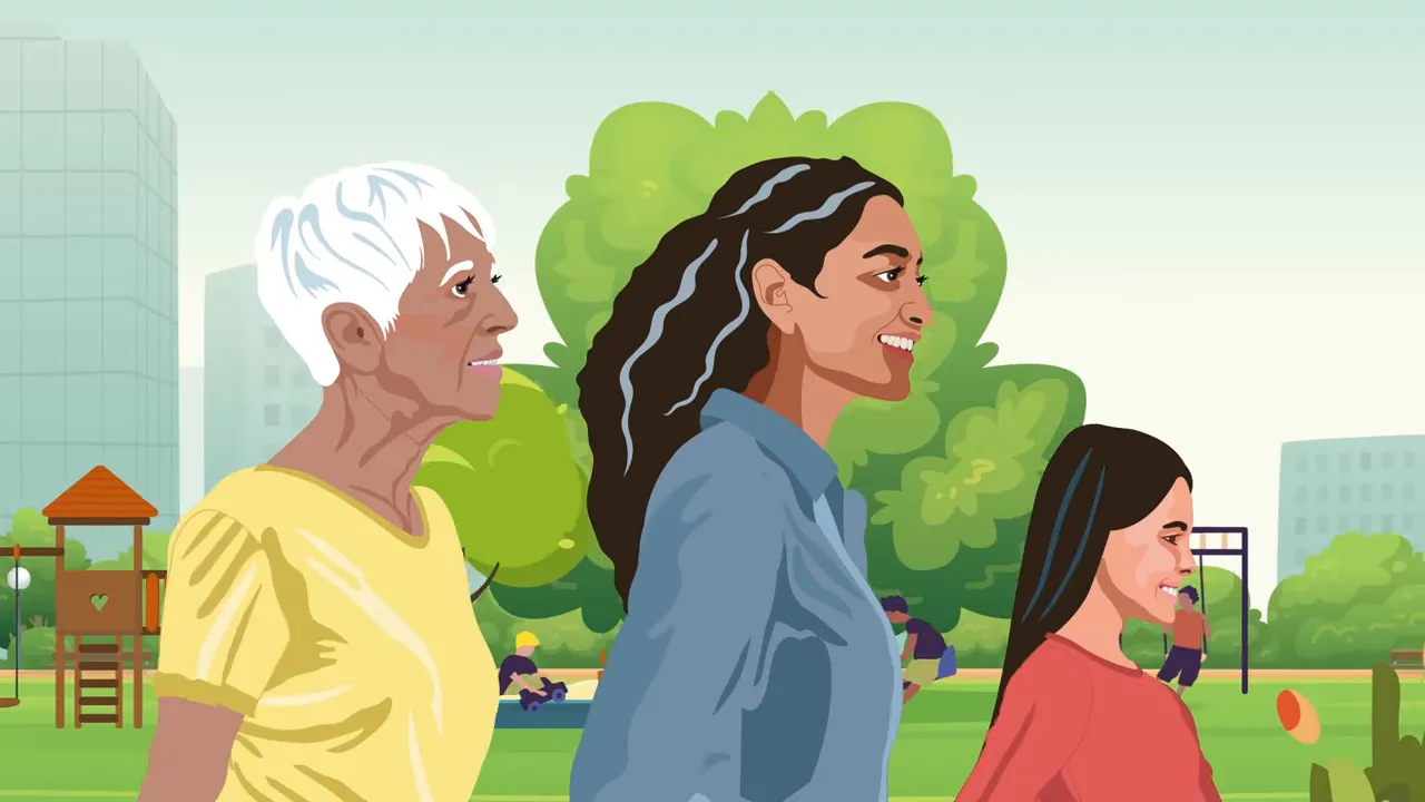 Older woman, adult caregiver, and child walking together in a park