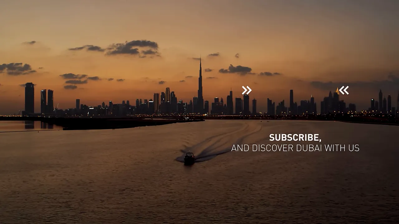 Wide Dubai skyline at sunset with a small boat crossing the water toward the city; on-screen subscribe text is visible.
