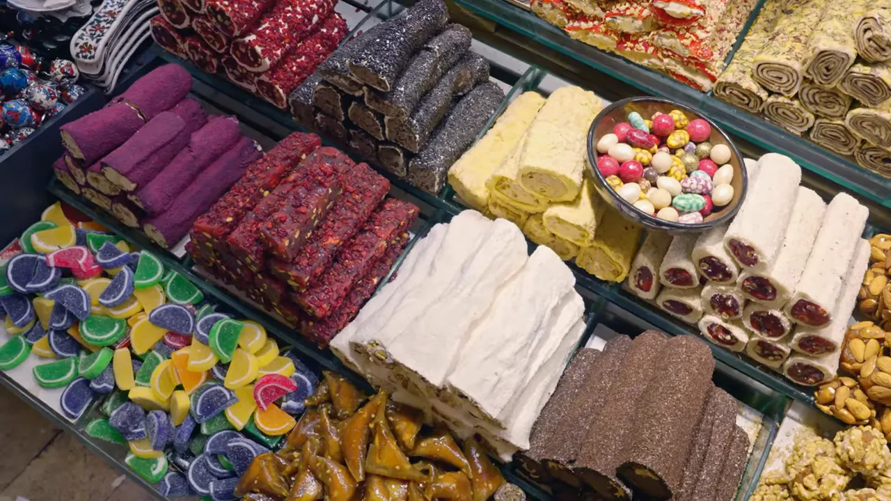 Assorted tray of Turkish delights and candies including fruit jellies, nut-studded lokum rolls and sugared pieces