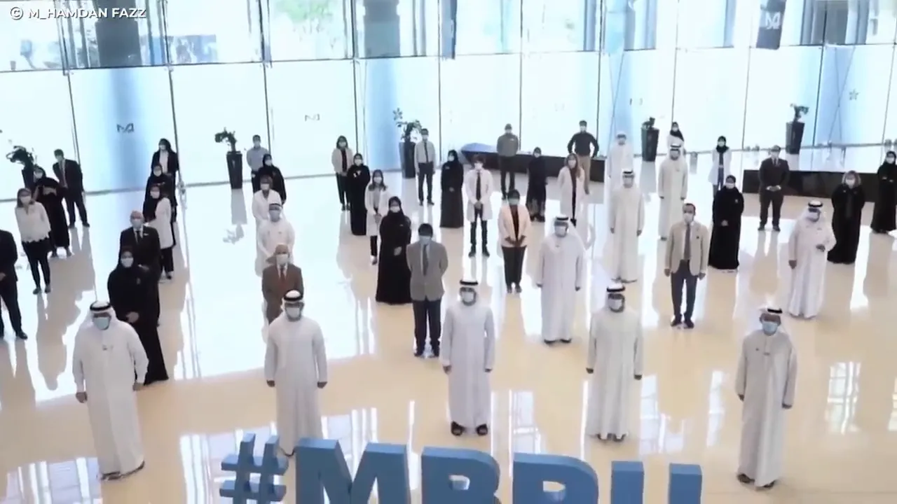 Officials and citizens standing in formation inside a public building, representing a community or government initiative
