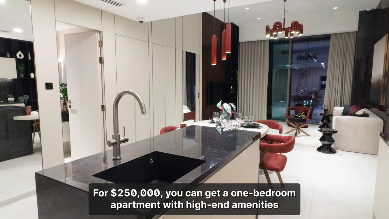 Modern one‑bedroom apartment kitchen island and living area interior