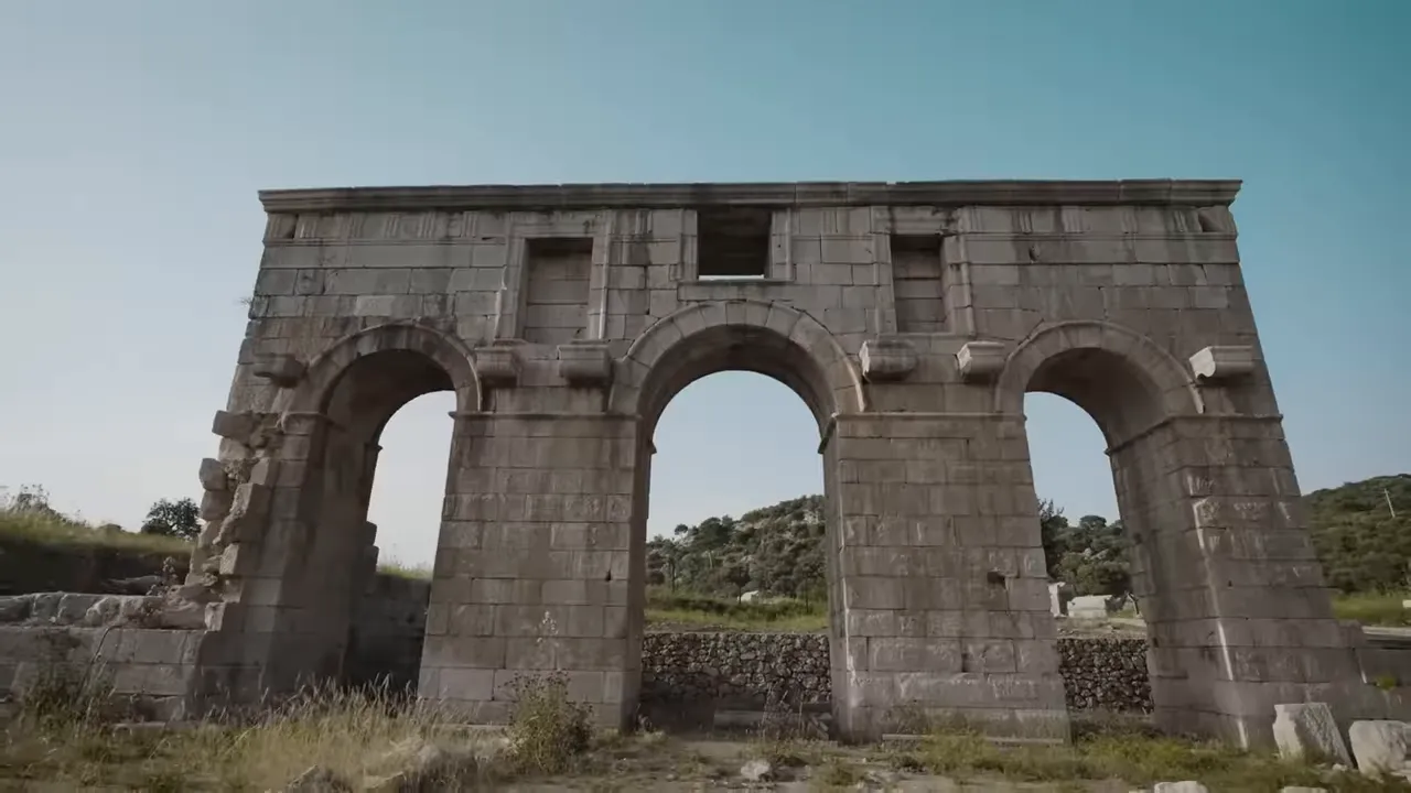 Three-arched stone facade of an ancient Lycian building at Patara