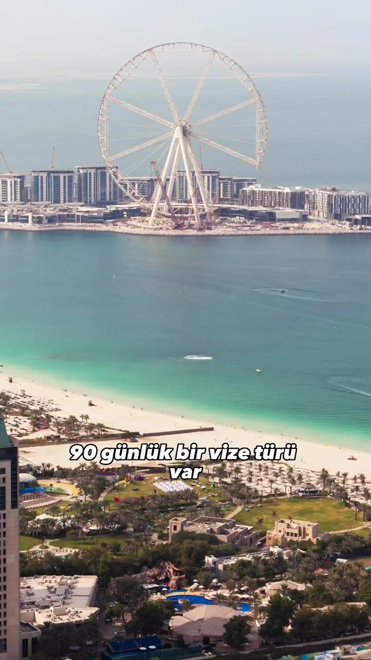 Dubai sahili ve b&uuml;y&uuml;k d&ouml;nme dolap g&ouml;r&uuml;n&uuml;m&uuml; ile 90 g&uuml;nl&uuml;k vize bilgisi