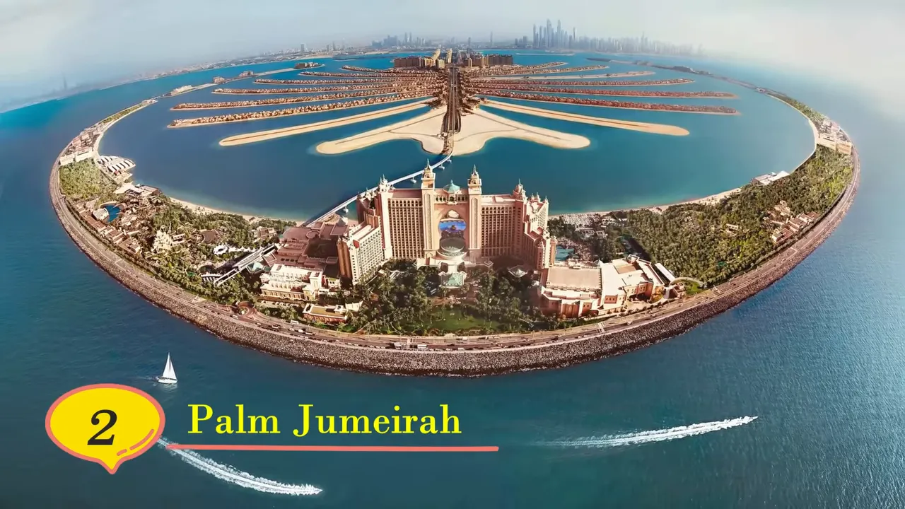 Palm Jumeirah aerial view showing Atlantis hotel, palm-shaped fronds and boats in the water