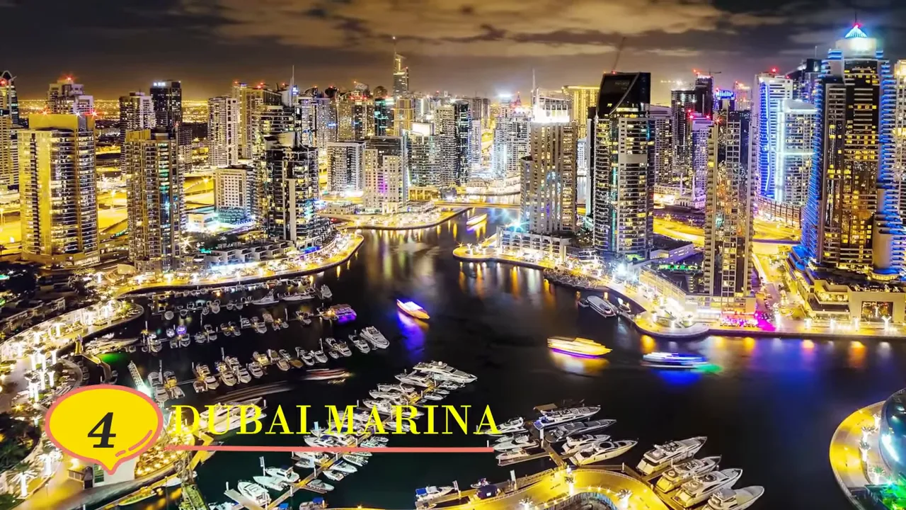 Dubai Marina at night with bright city lights, yachts in the marina and waterfront promenades