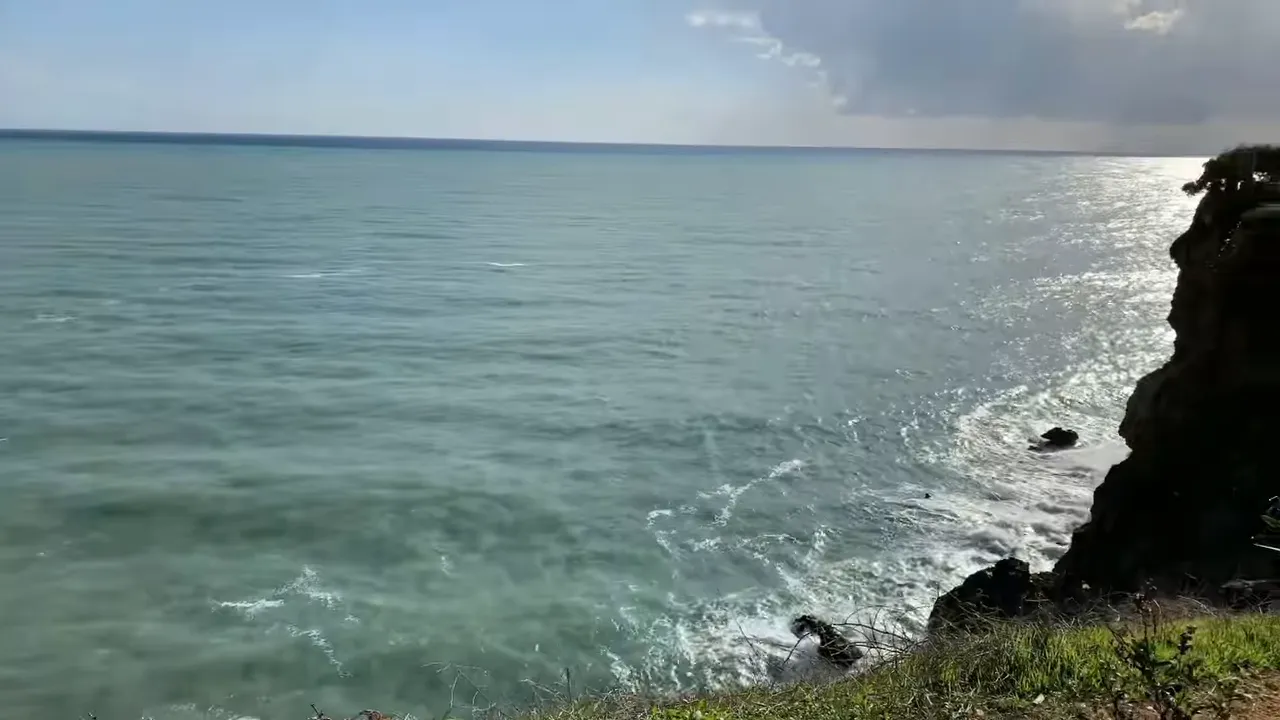 shimmering Mediterranean sea and coastal cliff viewed from the Antalya coastline