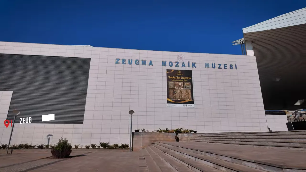 Exterior of the Zeugma Mozaik Müzesi with steps and clear signage under a blue sky