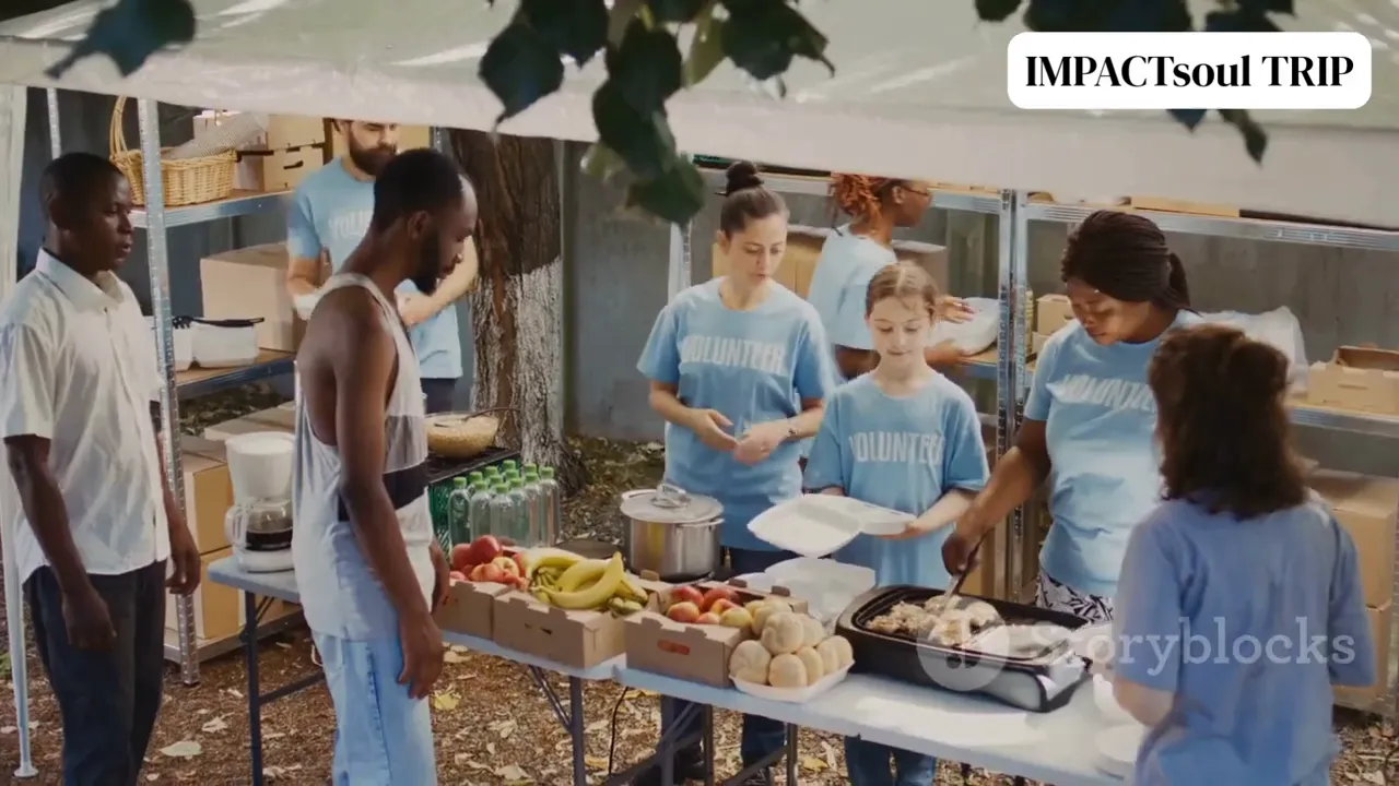 Volunteers in matching shirts serving food and organising produce at a community stall