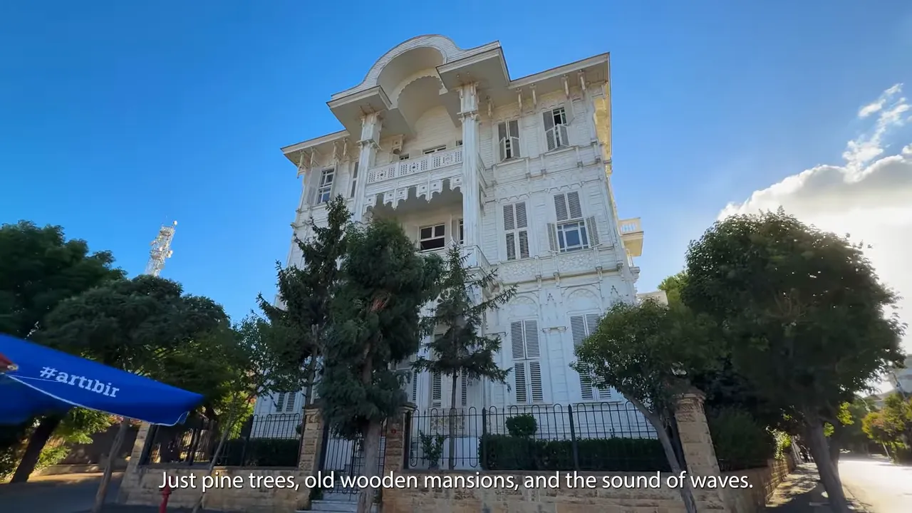 Old wooden mansion-style buildings on B&uuml;y&uuml;kada with pine trees and Turkish seaside atmosphere