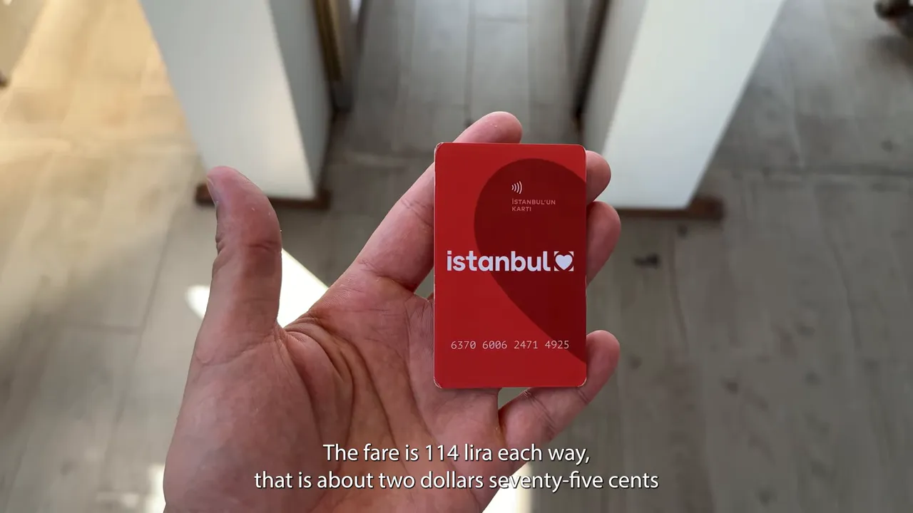 Hand holding an Istanbulkart card for public transit