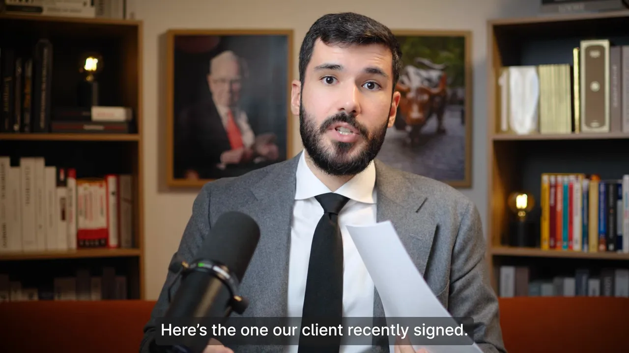 Presenter holding a booking document and speaking into a microphone, showing the paper to camera.