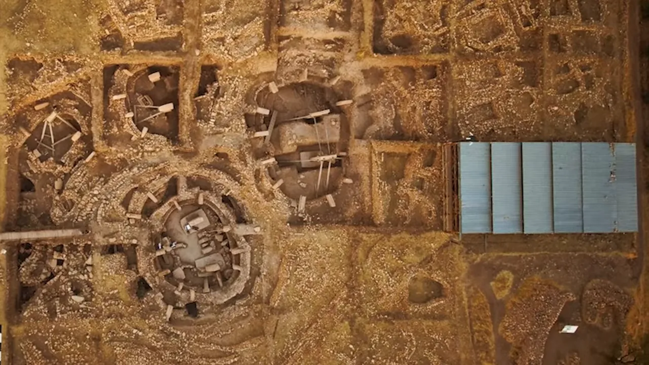 Aerial photograph of G&ouml;bekli Tepe archaeological site showing circular stone enclosures and excavation trenches