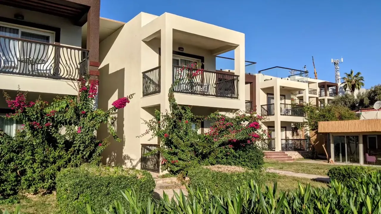 modern apartment building with balconies and bougainvillea in Bodrum