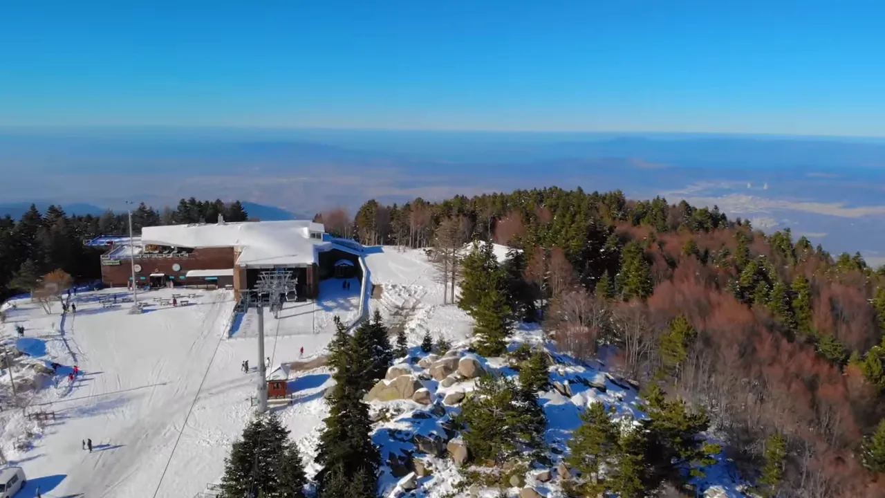 Aerial view of Uludağ ski station, snowy slopes and surrounding pine forest near Bursa, Turkey.