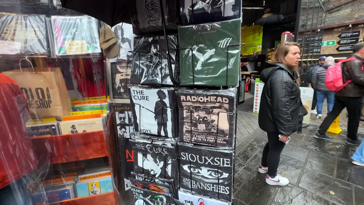 Stall selling vinyl records and band-themed boxes at Camden Market