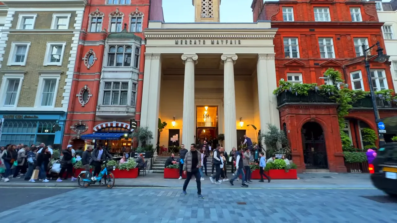 Mercato Mayfair entrance with classical columns and people outside