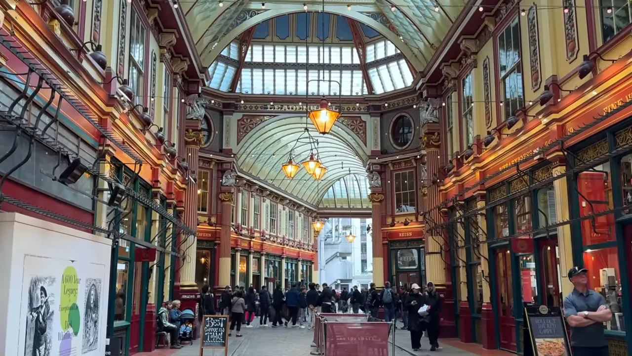 Leadenhall Market interior showing the vaulted glass roof, hanging lamps and decorative columns