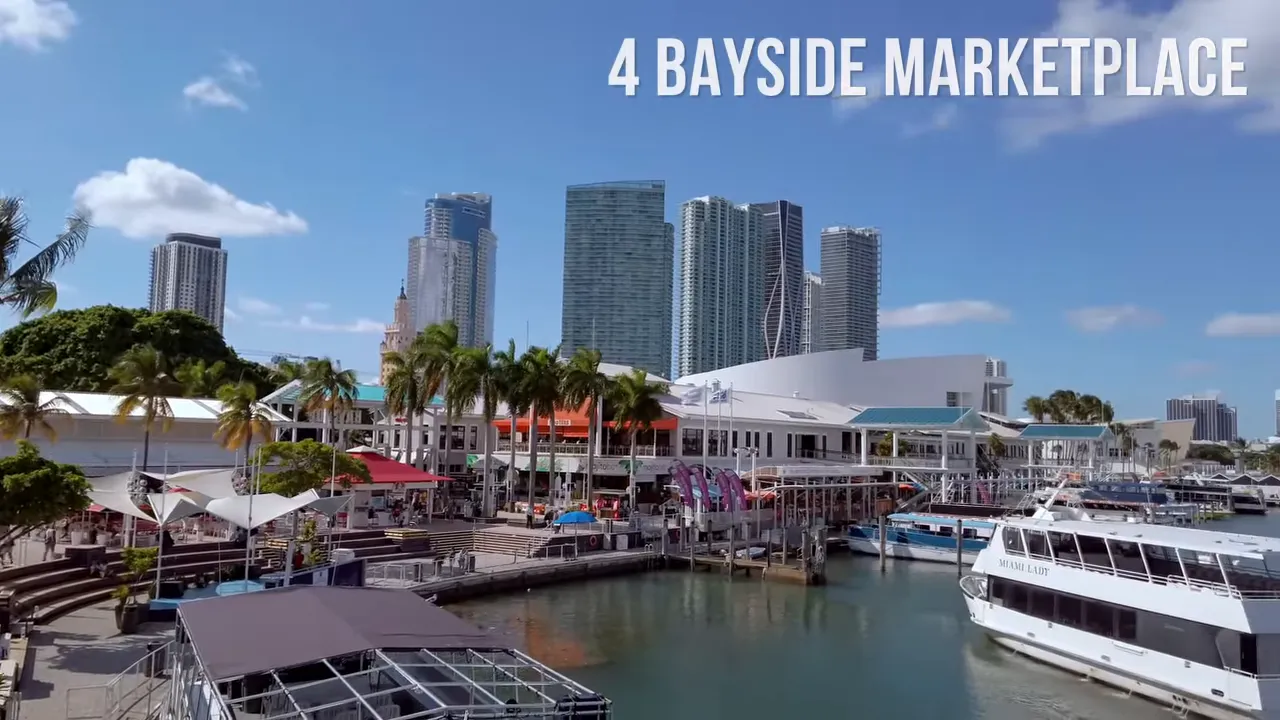 Bayside Marketplace waterfront with docked tour boats and downtown Miami skyline