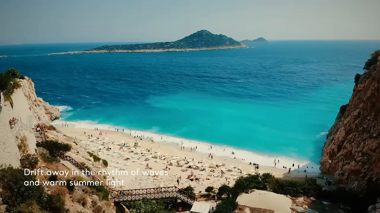 turquoise Mediterranean bay with sandy beach and rocky cliffs
