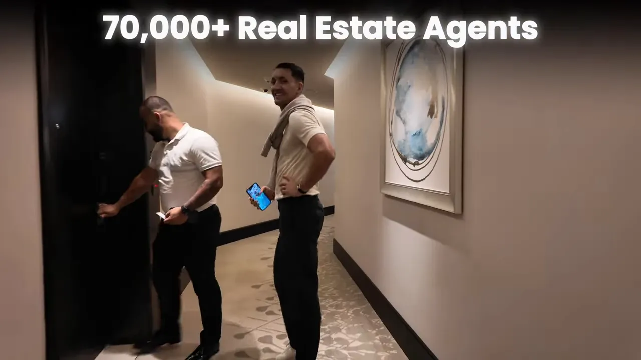 Two men in a building corridor with overlay text '70,000+ Real Estate Agents' emphasizing the large number of agents.