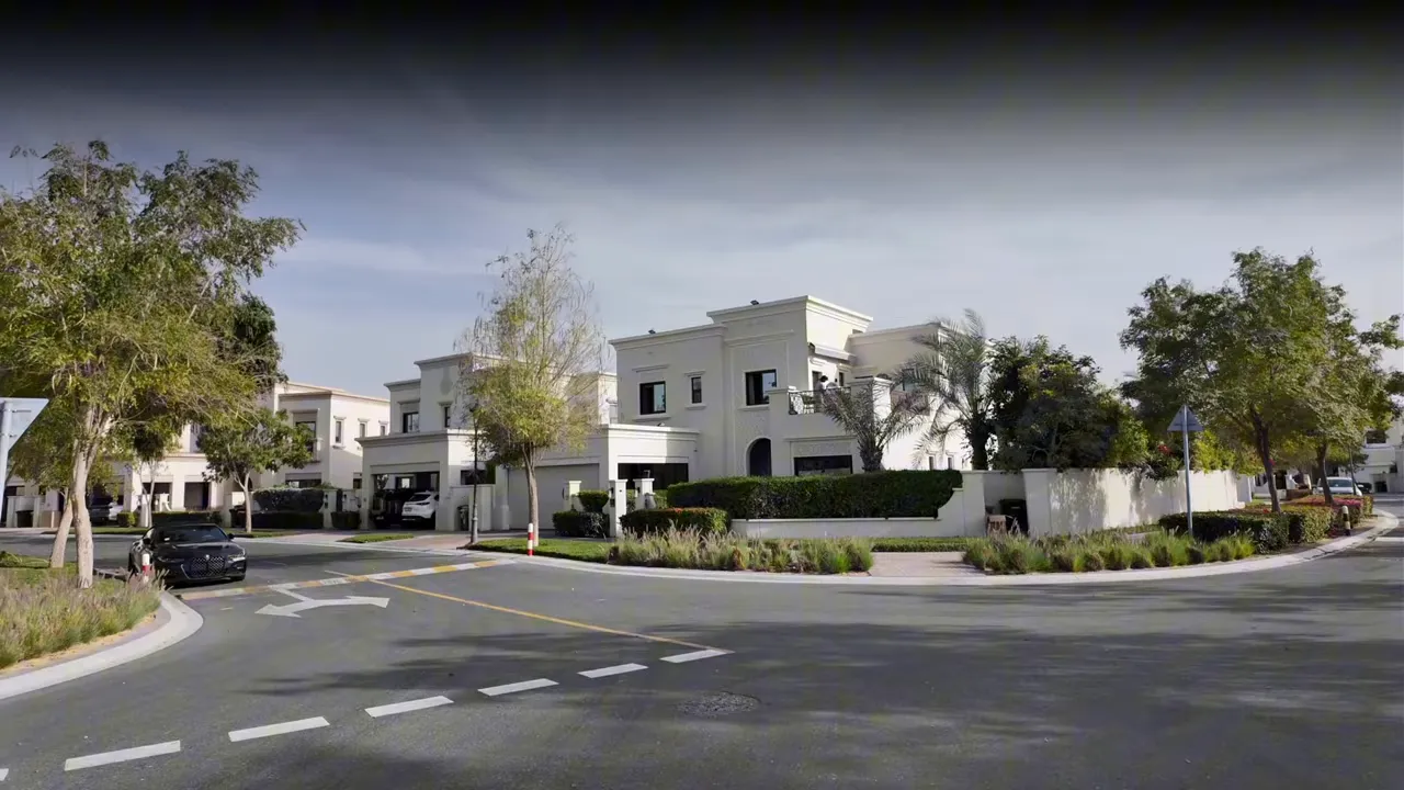 Residential Dubai villas on a tree-lined street, showing a villa/townhouse neighbourhood and quiet road.