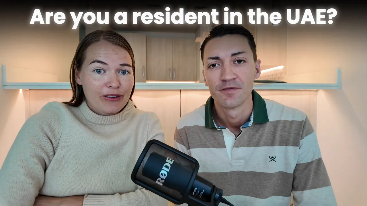 Two hosts on camera with overlay text 'Are you a resident in the UAE?' and a microphone in the foreground